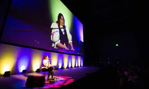 Saxton Speakers woman on stage