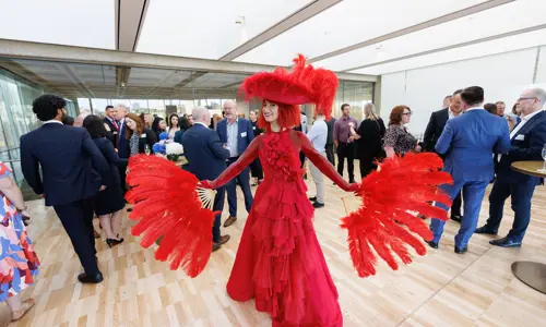 Networking event woman in red costume 