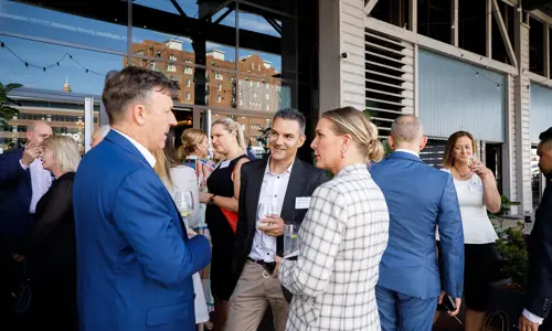 About Us Our Network Team Sydney Besydney Networking Event People Speaking Outside Doltone House