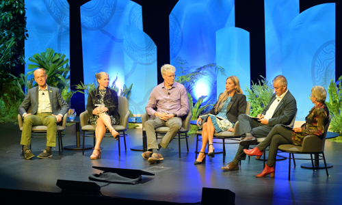 Panel of five speakers and moderator on stage at the Global Nature Positive Summit