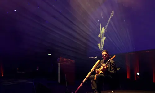 Besydney Ambo Dinner 2024 performance on stage guitar