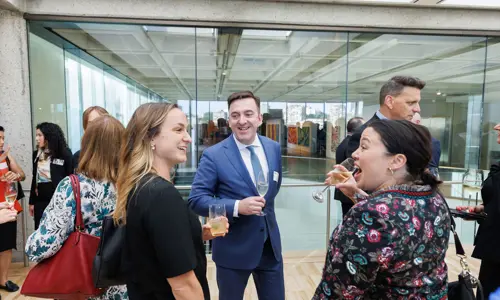 Networking event people listening speaking 