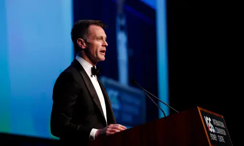 The Hon Chris Minns MP Besydney Ambassador Dinner 2024 on stage