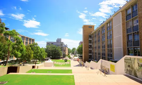 University of New South Wales (UNSW) electrical engineering building and University Mall, grass and trees on a sunny day