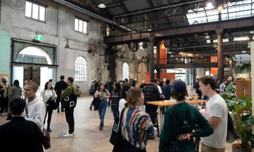 Attendees at an event held at one of the industrial halls at Carriageworks