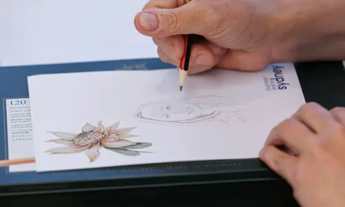 Close up drawing a sketch of a woman