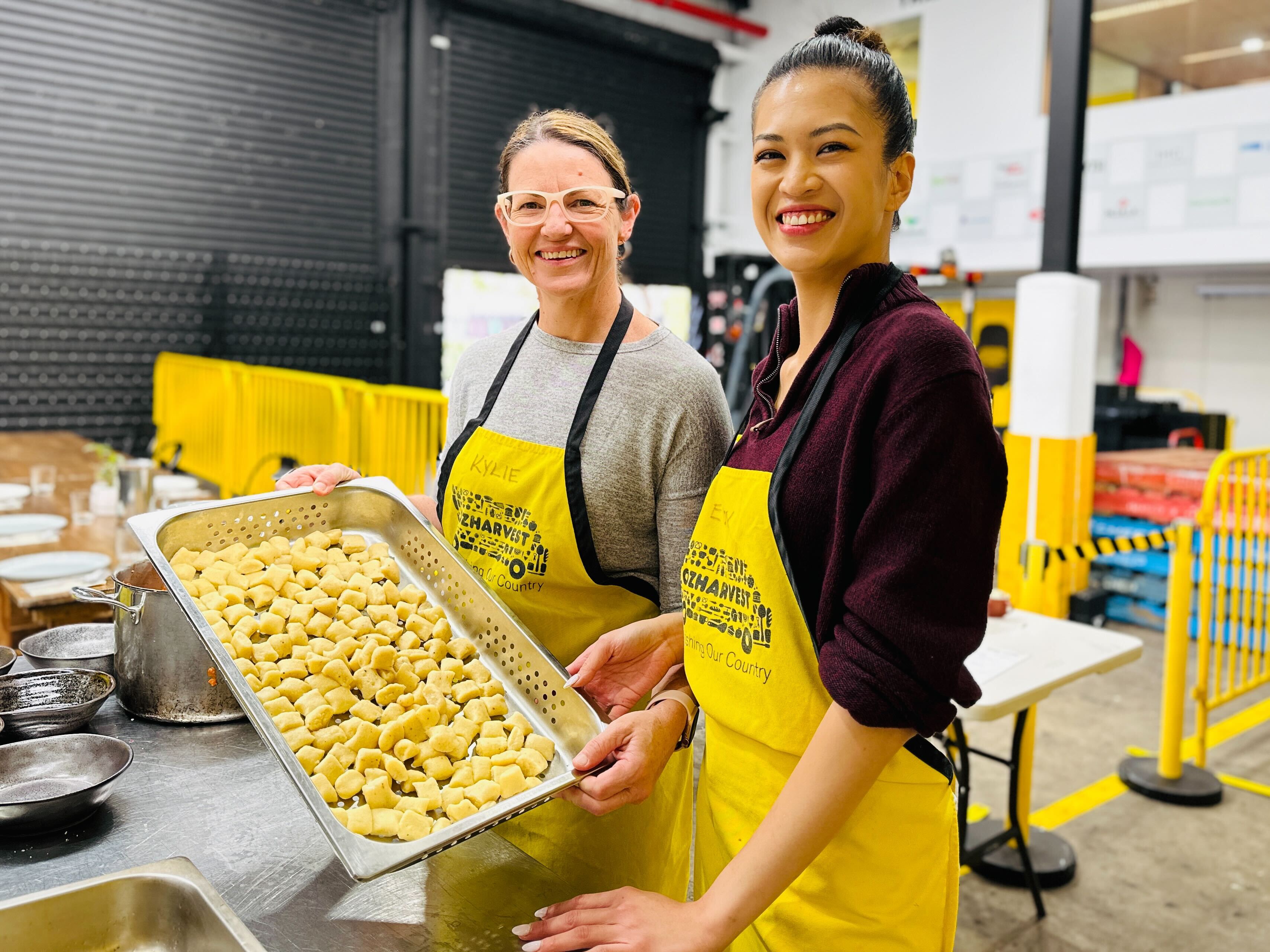 OzHarvest CSR activity two women making food