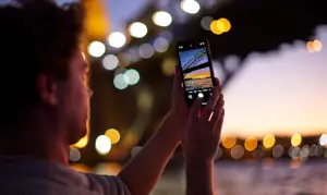 Photo of an individual taking a photo of the harbour bridge