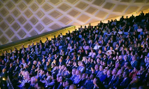 Large group of people in audience at conference