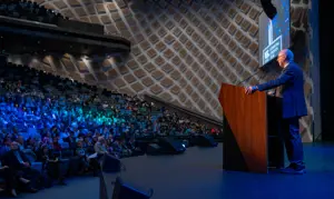 CS 060824 ISPRM World Congress 2024 Speaker On Stage Facing Audience