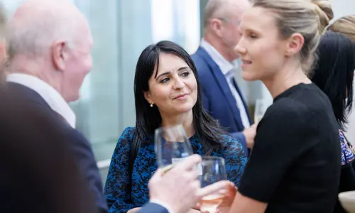 Networking event people speaking 