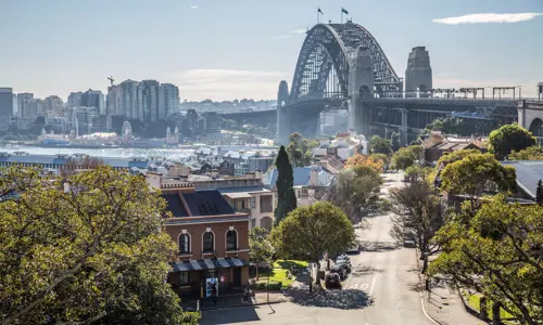 View of the Harbour Bridge from the side at The Rocks in Sydney on a sunny day