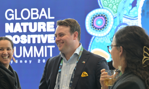 Three Delegates Interacting On Expo Floor at the Global Nature Positive Summit