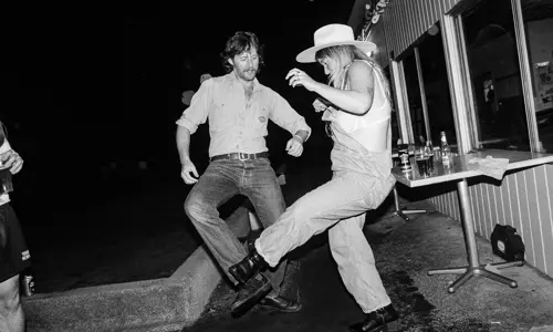 Two guests kicking legs up at Young Henrys